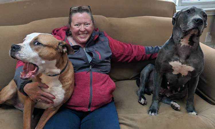 Co-Owner Susan Osbourne with two Pit Bulls